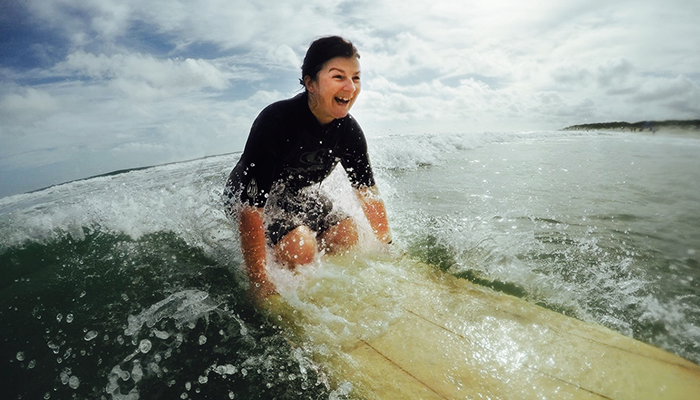 Woman beginning to surf